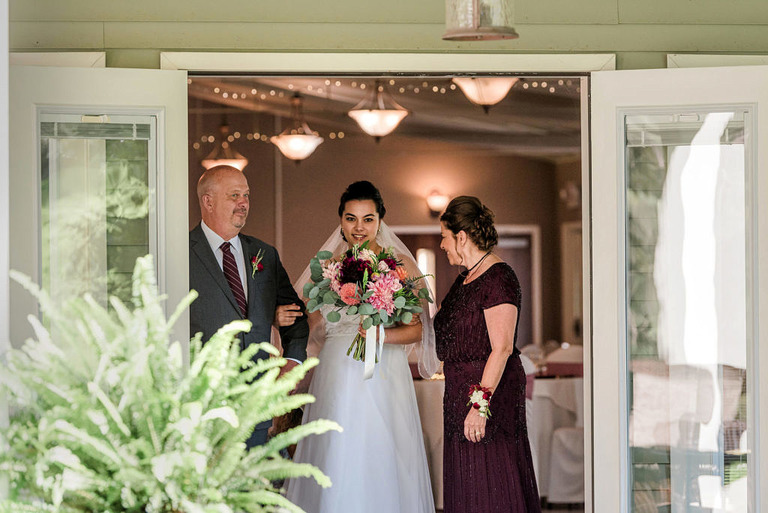 Bride peeking at guests at Fox Hill