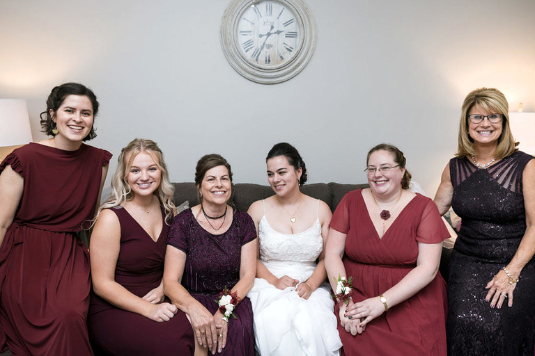 group photo of a bride and her wedding party at fox hill event center