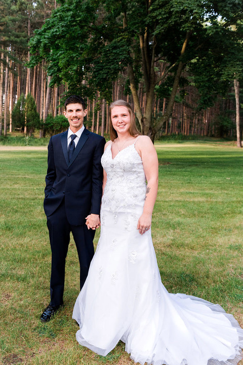 a wedding couple standing near Elk Lake