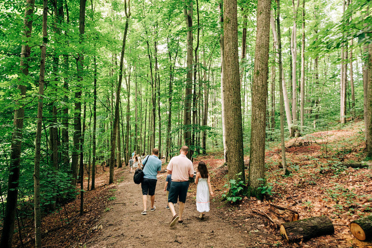 family walking down a trail at the Michigan Legacy Art Park at Crystal Mountain