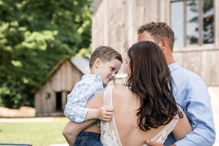 bride dances with young son at Iron Fish Distillery