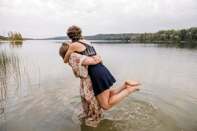 two women stand in the lake at Labrys resort
