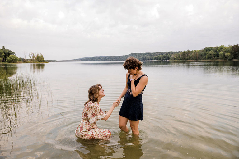 two women in the lake during an engagement photo session at Labrys resort