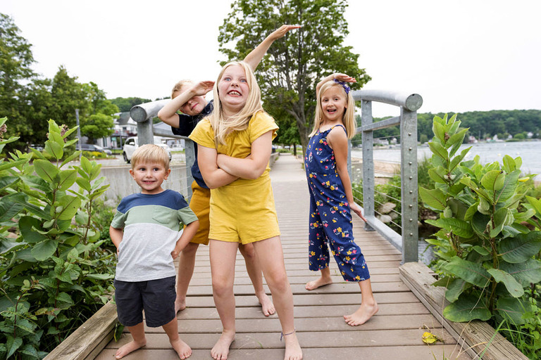 kids silly posing on small bridge
