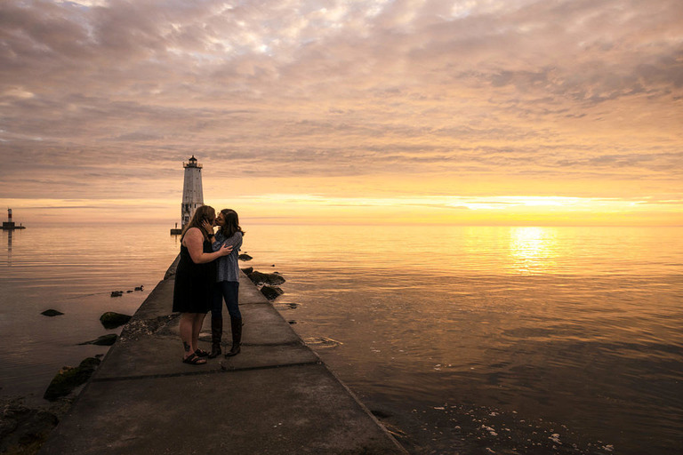 sunset and a kissing couple on frankfort beach