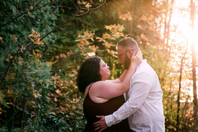 a couple hugging with a sun flare