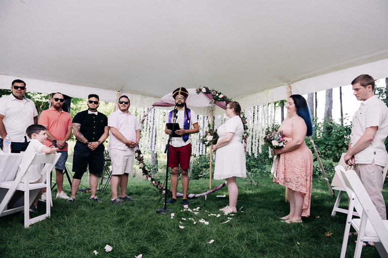 ceremony photo with officiant and silly hat