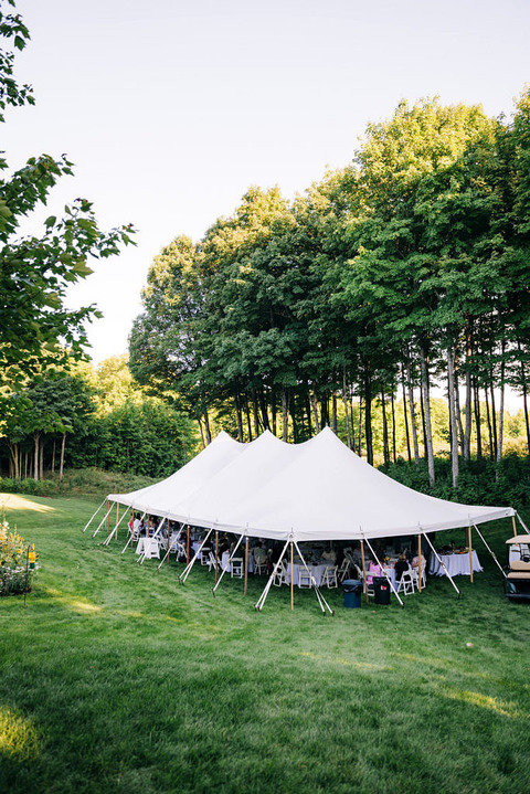 outdoor wedding tent on a green lawn