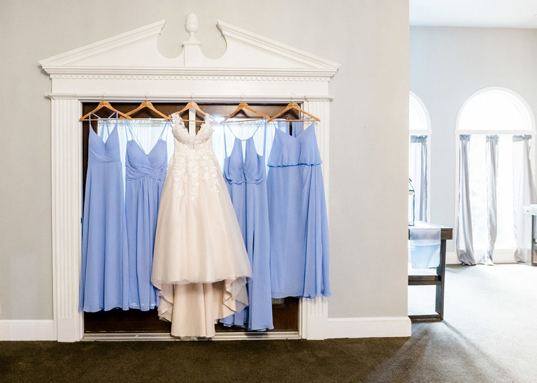 bride and bridesmaid dresses hanging at Greystone