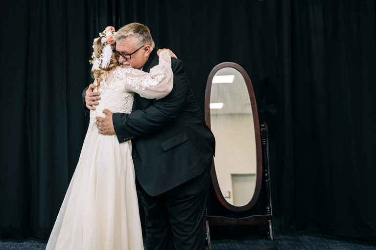 bride and her dad hugging