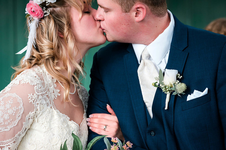 a bride and groom kiss 