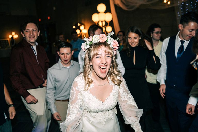 bride laughing on the dance floor