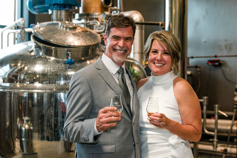 a-newly-married-couple-inside-the-distillery-at-Iron-Fish