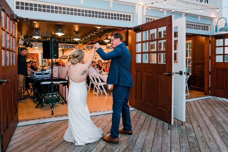 a couple's first dance at the Elberta Life Saving Station.