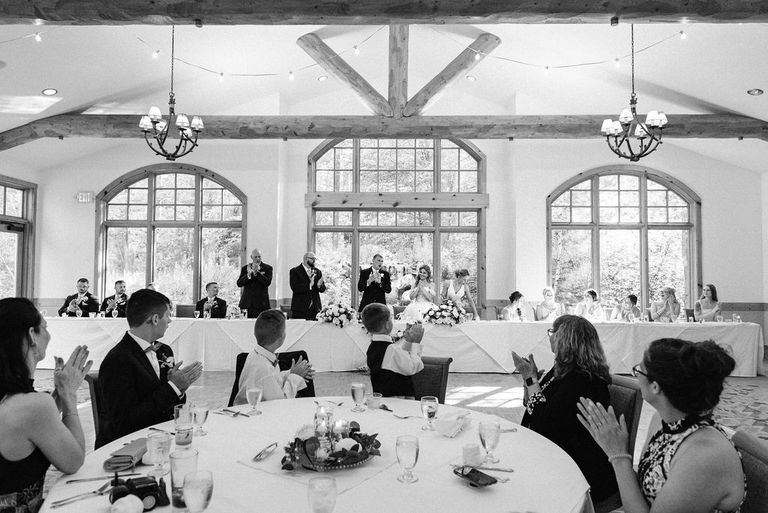 the head table at a wedding in black and white