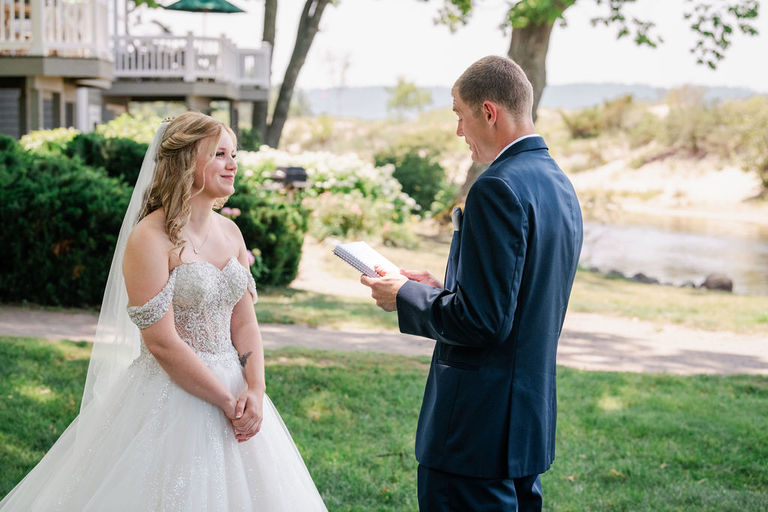 A couple speaks private vows to each other before their wedding at the Homestead.