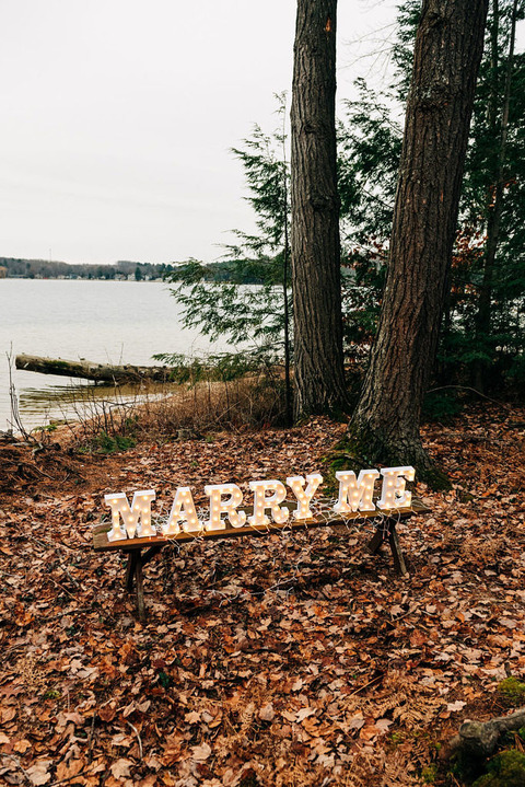 Letters lit up that spell Marry Me for a surprise proposal