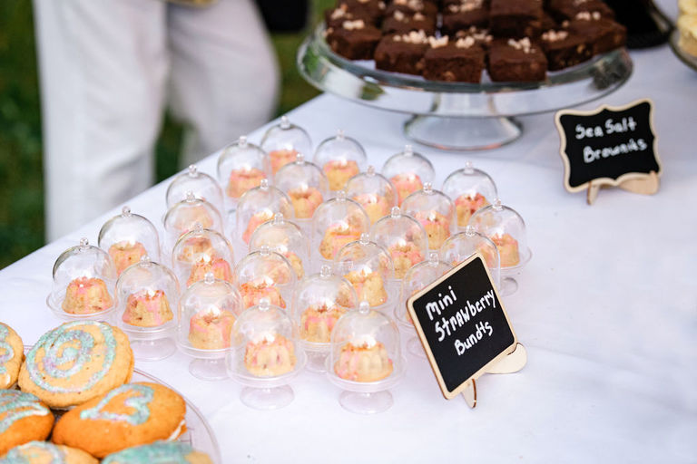 tiny bundt cakes under tiny domes at the wedding reception in Traverse city.