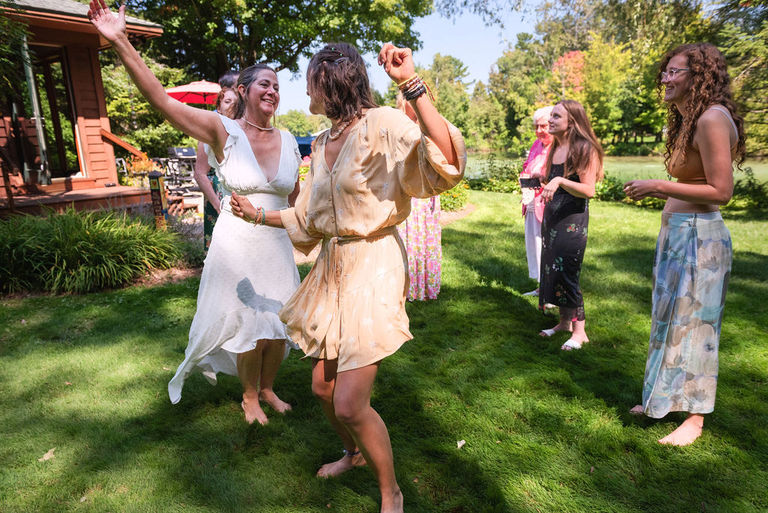 a family dances together in celebration after an outdoor micro wedding in leelanau.