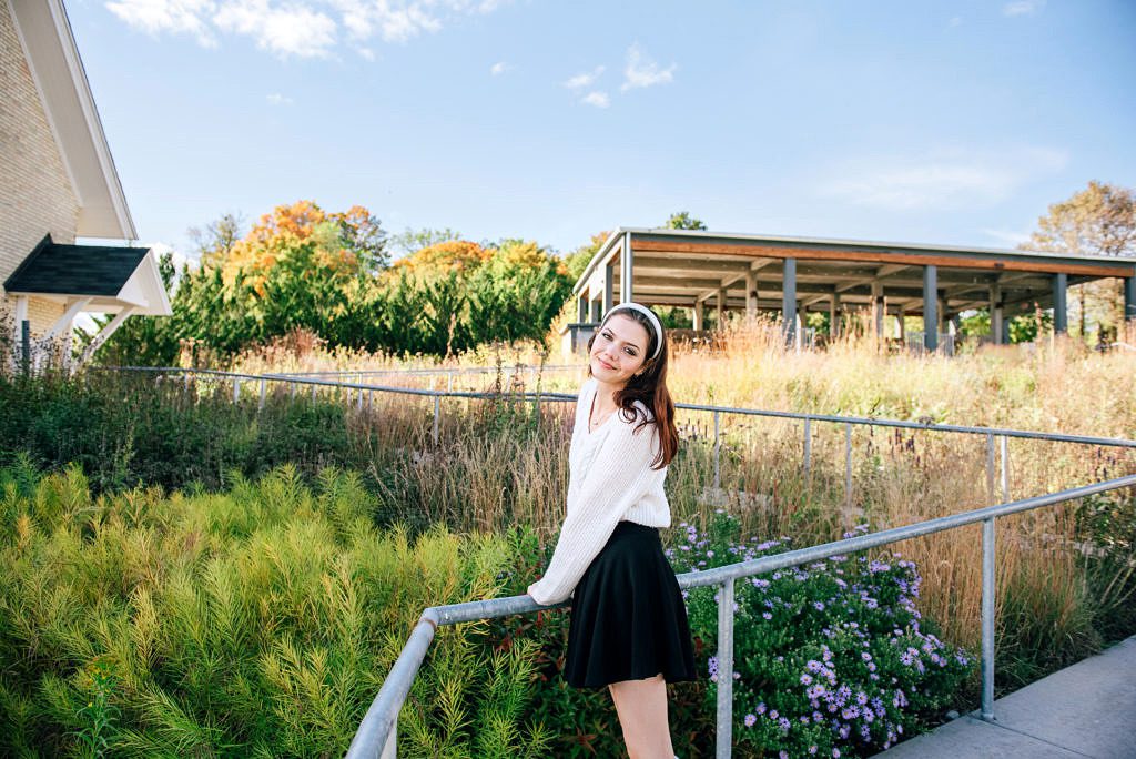 a senior photo taken at the botanical garden in traverse city