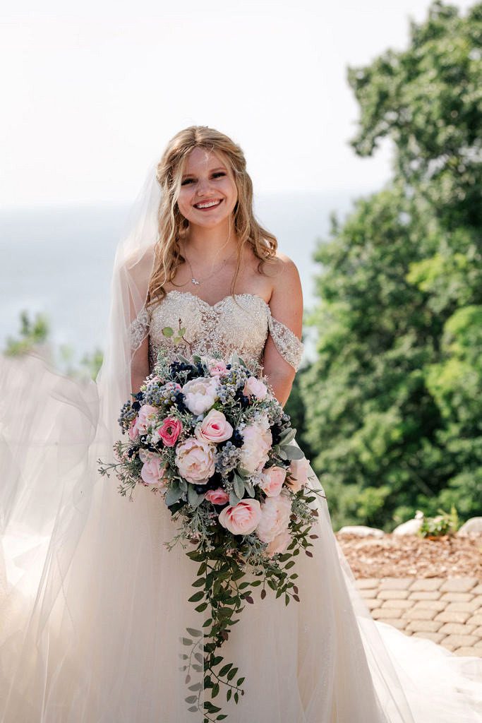 the gorgeous Jessica, bride posing at the top of the mountain at Crystal Mountain Resort.