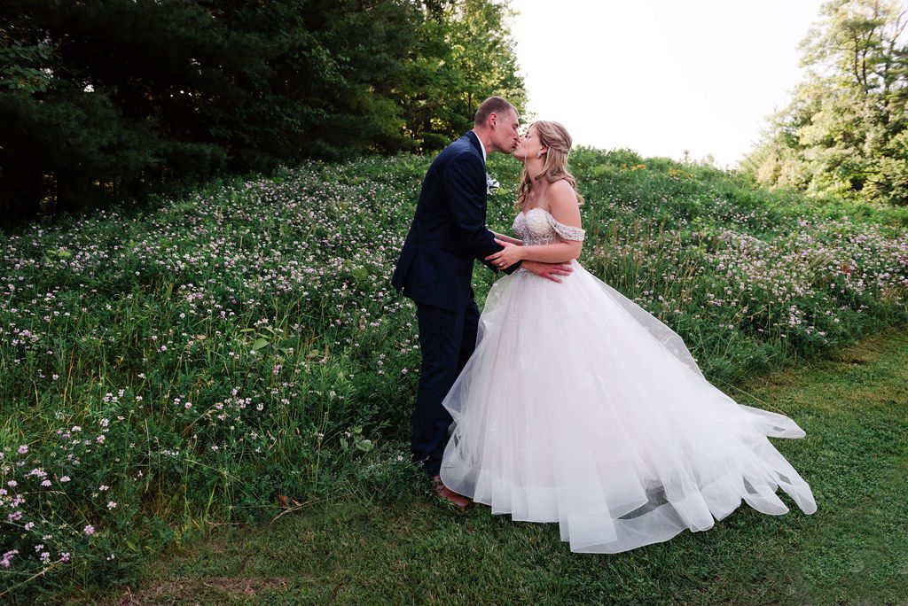 a wedding couple kisses on the rough at the homestead resort