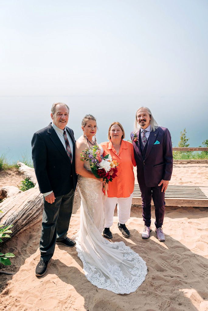 Family poses with lake Michigan in the background.